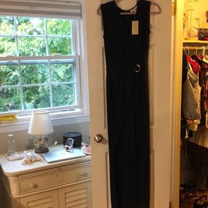 Michael Kors Navy blue jumpsuit with gold belt buckle detail.